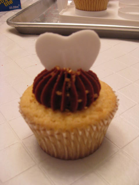 The final wedding cupcake Yellow cake with raspberry jam filling and 
